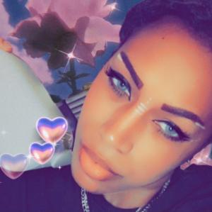 Woman holding oculus quest two.