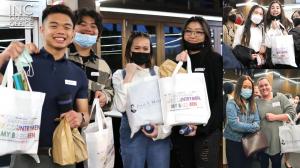 young people smiling for a group photo while holding up their care packages that they received from the Iglesia Ni Cristo (Church Of Christ) a global church