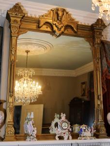 Huge gold gilded Egyptian style mantel mirror with Egyptian royalty crown, 87 inches tall (est. $3,000-$5,000).