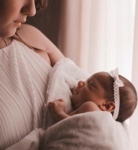 Mother holding newboarn