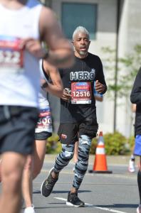 Sekou Writes completes his first half marathon (Nashville's Rock n Roll half) while wearing a black and white hero t-shirt