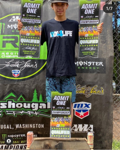 Jayden Riley, from Red Deer, Alberta holding his 3 tickets to the Monster Energy AMA Amateur National Motocross Championship
