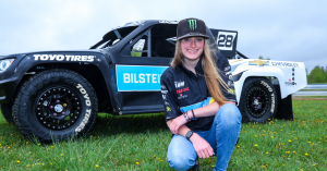 Gray Leadbetter poses with her No. 28 Bilstein Chevrolet race truck.