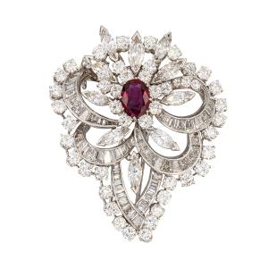 Platinum pendant featuring ten claw-set marquise-shaped diamonds and 96 other diamonds, plus one claw-set, 2.04-carat natural ruby (est. CA$16,000-$19,000).