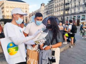 Scientologists in Madrid distributing The Way To Happiness
