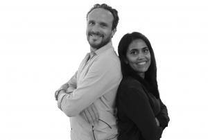 Two people/ business executives standing next to each other