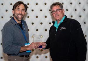 Erik and Glen pose with the award