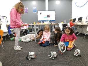 Girls learning to program robotics