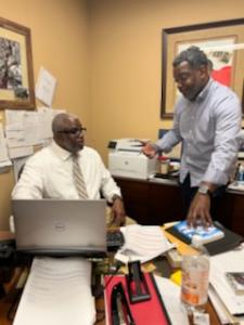 Superintendent Forrest (left) and Jean Regnier (right) discuss TWS summer program