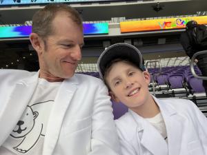 Egonaut holder Matt Kuhlhorn and his son Taj attending VeeCon 2022 at US Bank Stadium in Minneapolis sporting their matching Prudent Polar Bear shirts