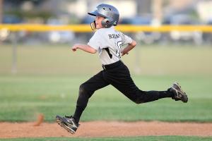 Boy running bases