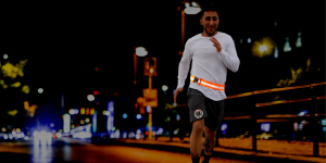 runner at night with reflective belt