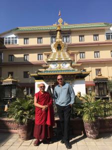 Film director standing with Buddhist Monk in Kathmandu, Nepal