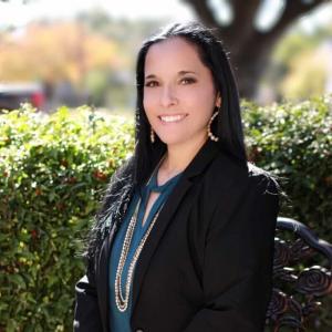 professional head shot image of lady with black hair