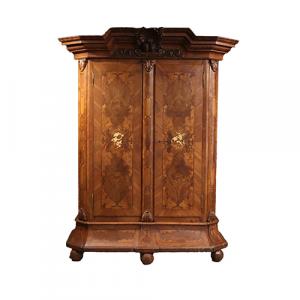 German 18th century Baroque carved and inlaid walnut armoire.