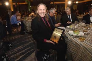 Mr. Kenneth W. Welch Jr. Holding The “Inventor of the Year Award”