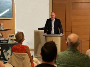 Foundation for a Drug-Free World Northwest representative David Scattergood briefs those attending an International Day Against Drugs open house on recent drug trends and solutions.