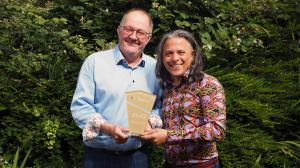 Image of Mark Povey, Technical Director And Sunny Curwen, Director Of Development At JS Information Governance Limited (JSIG) holding award win trophy