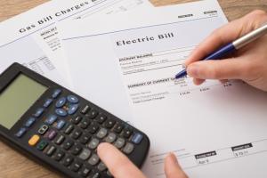 Electric bill charges paper form on the table