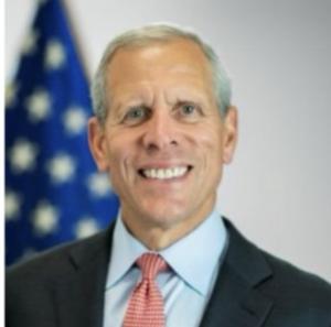 Photo Headshot of man in suit & tie: Paul Mango, Veteran Supporter and Former Deputy Chief of Staff at the U.S. Department of Health and Human Services