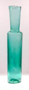 This important green bottle recovered from the S.S. Central America is a rare surviving example of a Gold Rush-era wide-mouth glass tool used in obtaining samples from a wine barrel. (Photo credit: Holabird Western Americana Collections.)