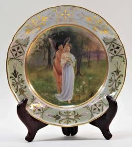 Late 19th/early 20th century German Meissen porcelain plate showing a blonde, bare-breasted woman with a winged nymph, 9 ½ inches in diameter (est. $300-$500).