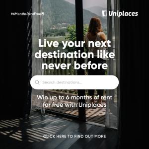 Promotional post created by Uniplaces to share news of its new campaign with followers. The photo depicts a woman standing on a balcony outside a room's curtains and windows, observing a green landscape that surrounds her field of view.