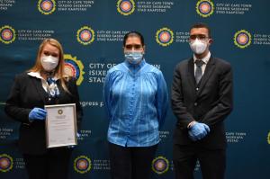 Cllr Sumaya Taliep (middle), Mandy Pelser(left) and Dylan Cefail (right) of the Church of Scientology