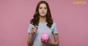 Woman poses with piggy bank and coin for Liveplex's easy payment system
