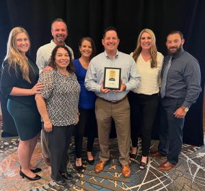 Photo of La-Z-Boy Southwest Region accepting Top Workplaces Award.