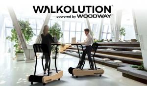 Treadmill Desk from Walkolution used in a corporate setting for a walking meeting