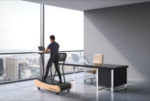 CEO works on Walkolution treadmill desk