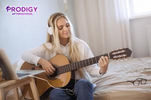 Student Learning Guitar with Prodigy's Online After-school Class