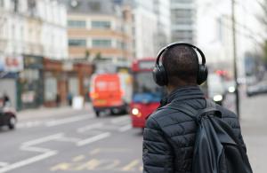 A picture of a person listening to Jerome Karam’s podcast interview on his walk to work