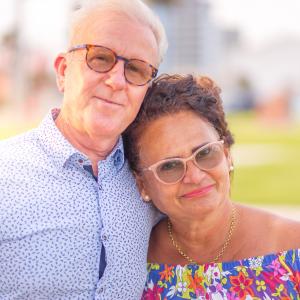 A couple on vacation from Brazil pose for a family photo session in downtown Corpus Christi, Texas.