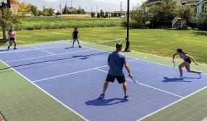 People playing on Sport Court's pickleball surface