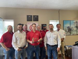 The College Station roofing contractor accepts the Versico Gold Medal Contractor Award