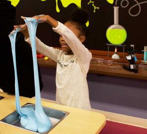 girl playing with interactive exhibit