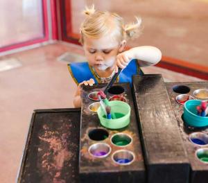 young girl painting at ImagineU