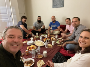 Jon Velie, CEO of OnlineVisas and VisasAI, and Immigration Attorney having dinner with the Aghan refugees during the free consultation sessions held by OnlineVisas team and organized by his daughter, Gabriella Velie.