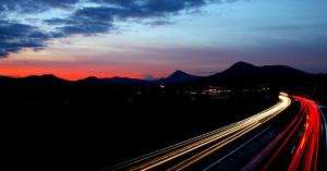 image of traffic at night with mountains in background