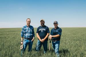 Carbon farming expert Travis Kraft with Jamie MacKinnon from Anew and CarbonNOW farmer Scott Scheimer