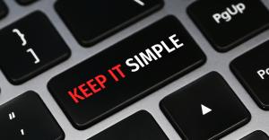 computer keyboard with the words "keep it simple" on one key