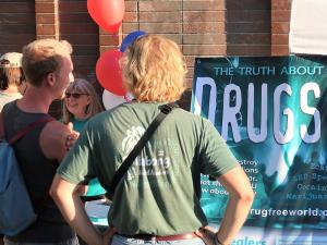 Guests at the Seattle Church of Scientology National Night Out block party check out the drug prevention resources of Foundation for a Drug-Free World.