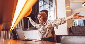  Woman at computer excited to be benefitting from Tandia’s launch of ASAPP’s new features.