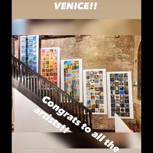 Image of five collaborative art projects aligning the staircase of a Venice gallery.