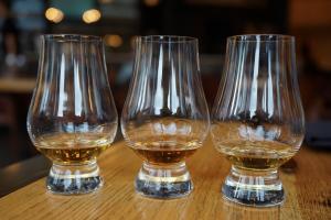 3 Glencairn glasses with different samples of Whiskies in them.