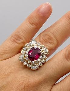 Burmese ruby and diamond ring with a 4.41-carat natural Burmese ruby surrounded by round and baguette diamonds set in 14kt yellow gold, retailed over $100,000 (est. $80,000-$90,000).