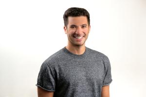An image of Clarity Value Founder and CEO, Cristian Robiou smiling and wearing a gray shirt.