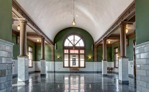 Photo of interior of Billings Depot vintage look with green walls and wood trim and white tile floors